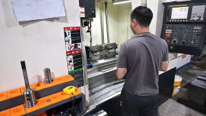 Slick-Worker-Operating-CNC-Machine